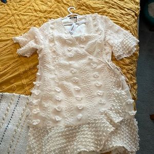 Never been worn boohoo wrap dress in white.